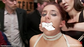 Blindfolded and gagged ginger naked slave Mischa Brooks in rope bondage gets whipped then pussy tazappered and fucked in public boutique